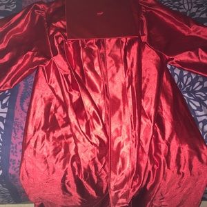 Shiny red cap and gown